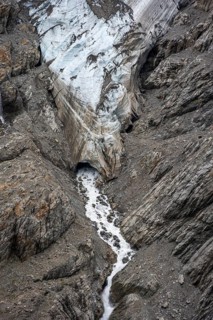 Glacier tongue and mouth with stream, mountain landscape, Grindelwald-Fiescherfirn glacier, Bernese