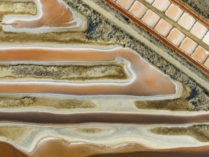 Saline ponds at the salt works near Chiclana de la Frontera. The orange-red colour depends on the