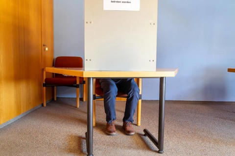 Election symbol: Man in the voting booth