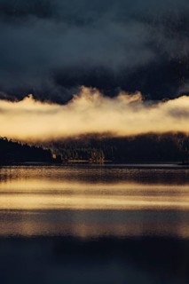 Sunrise with reflections in the Plansee in Tyrol in the Alps in Austria