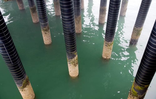 Pier support column pillars rise from sea at the seaside town of Cromer, north Norfolk coast,