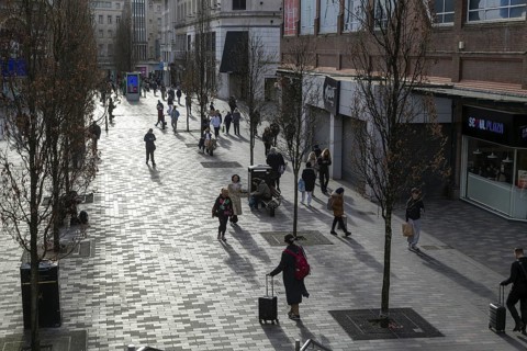Shoppers walking on pedestrianised Eliot Street in city centre, Liverpool, England, UK