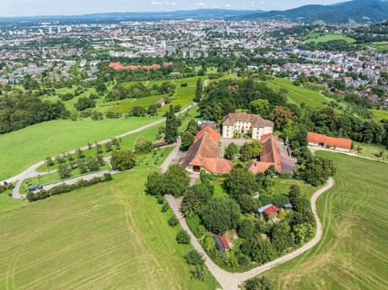 Aerial view of castle Jesuitenschloss Merzhause and city Freiburg, Germany
