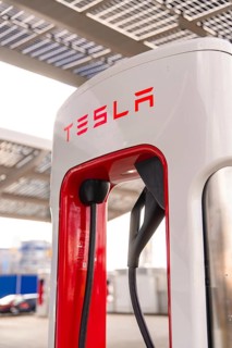Close-up of a Tesla charging station under a modern canopy, Tesla, New Model Y Juniper, Germany