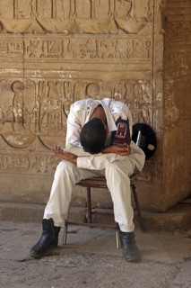 Sleeping guard and hieroglyphics in the Temple of Edfu, ancient Egyptian temple on west bank of the