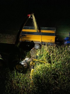 Tractors harvesting maize at night, trailer being filled, maize harvest, Dachtel, Black Forest,