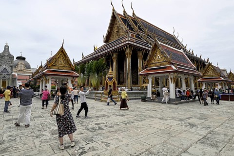 Tourists at Wat Phra Kaew, Temple of the Emerald Buddha, Bangkok, Thailand
