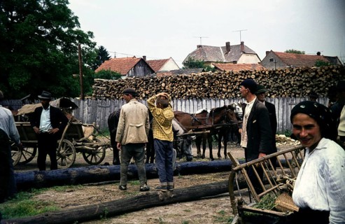 Group of people at the timber market in a rural environment, Romania, Eastern Europe 1967
