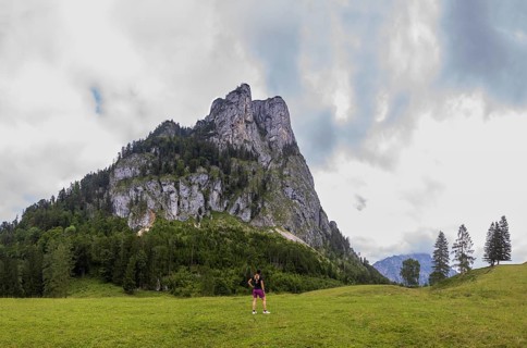 Hiker on the Schartenalm with a view of the Sparber, Osterhorn group, Salzkammergut, Salzburg