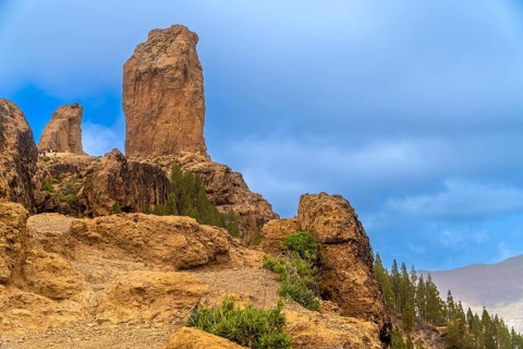 Volcanic rock formations of roque nublo dominating the landscape of gran canaria, spain, under a
