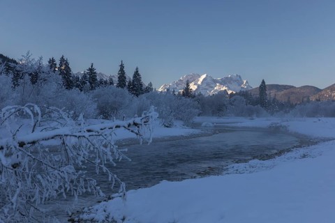 Isar valley in winter at temperatures of minus 18 degrees Celsius. Snow covered landscape with the