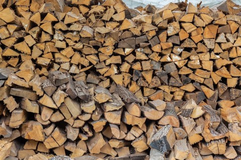 Large pile of cut and stacked firewood, Quebec, Canada
