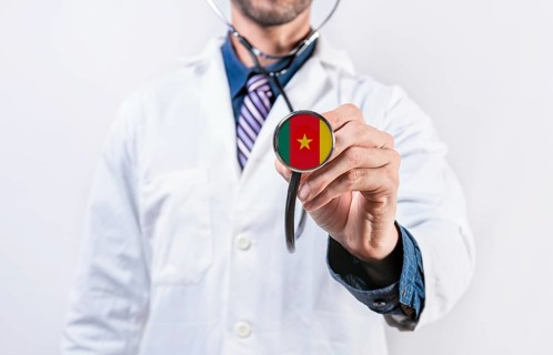 Cameroon healthcare system, doctor holding stethoscope. Cameroon health and medical insurance