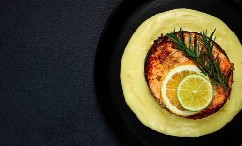 Salmon steak, fried, mashed potatoes, top view, rosemary, lemon and lime, homemade, one serving, no