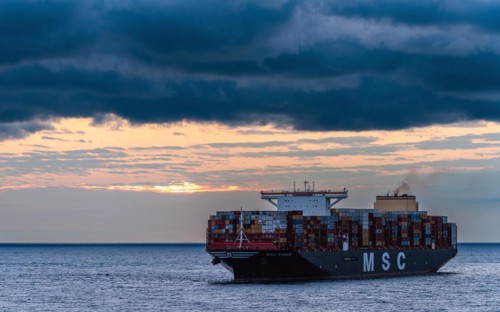 Maersk Line Container Ship on sea at sunrise, Barcelona, Spain