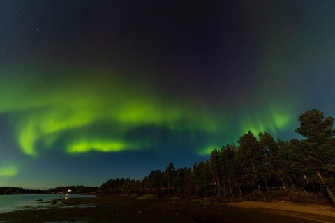 Northern lights, (Aurora borealis) at a lake near Kiruna, September 2024, Lapland, Sweden