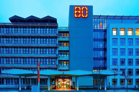 Main building of Bochum University with red BO logo in the evening, Central Campus, Bochum, Ruhr
