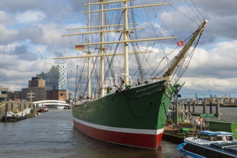 St. Pauli Landungsbrücken with sailing ship and Elbe, Elbe Philharmonic Hall in the background,
