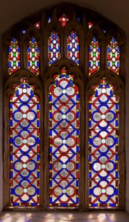 Stained glass window geometric red and blue pattern possibly by Henry Fiske, Middleton church,