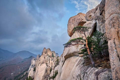 View of stone and rock formations from Ulsanbawi rock peak in stormy weather. Seoraksan National