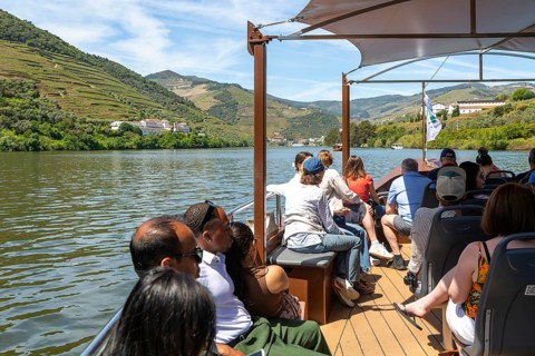 People passengers on rabelo boat trip River Douro valley, near Pinhao, Alto Douro, Portugal