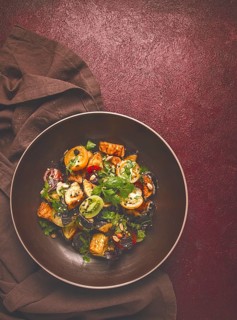 Warm Salad, Saksuka, with crispy eggplant, and tomatoes, spices, herbs, sesame seeds, sunflower