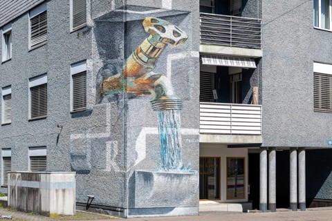 Apartment block wall painting tap