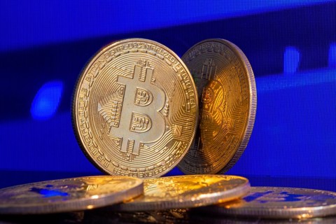 Close-up of symbolic bitcoins