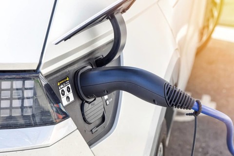 Charging the battery of an electric car with electricity E-car at an electric petrol station petrol