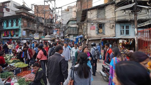 Crowd packed at a street market, vendors offering their goods, Kathmandu, Nepal