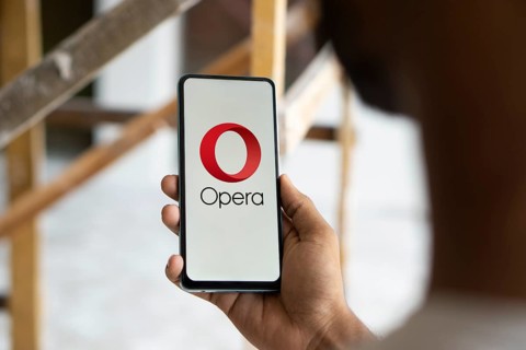 Opera logo is displayed on smartphone. Opera is a multi-platform web browser developed by its
