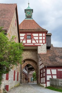 Gatehouse with half-timbering and tower clock, Cadolzburg Castle, Bavaria, Germany