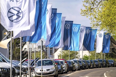 Flag of the car manufacturer Volkswagen, VW, at a VW car dealership, new and used cars, North
