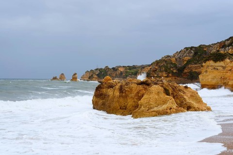 Rocks on the coast in the surf, Praia Dona Ana, Lagos, Algarve, Portugal