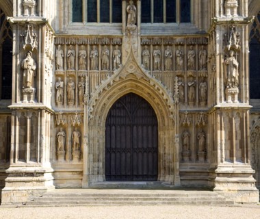 Stone statues around wooden doors Beverley minster, Yorkshire, England, United Kingdom