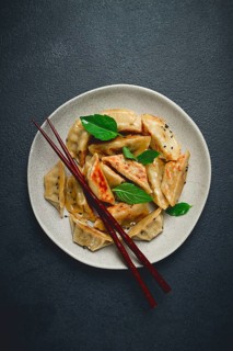 Japanese fried dumplings, gyoza, sesame seeds, top view, no people