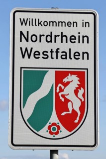 Welcome to the state border of North Rhine-Westphalia, welcome sign, state coat of arms, Burbach,