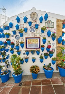 Blue flower pots on whitewashed wall, Patio de las Comedias, Castle of Iznajar, Castillo de