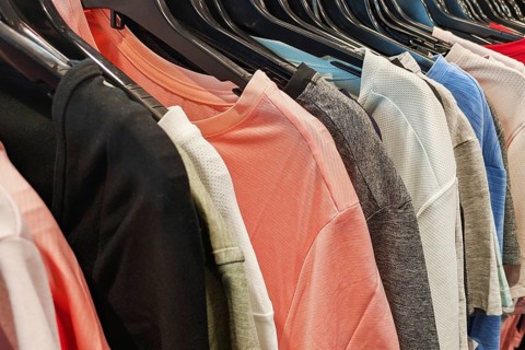 Heidelberg, Germany - 19th March 2026: Various tops and T-shirts in different colors and styles