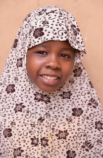 Girl wearing a headscarf, Stone Town, Zanzibar City, Zanzibar, Tanzania
