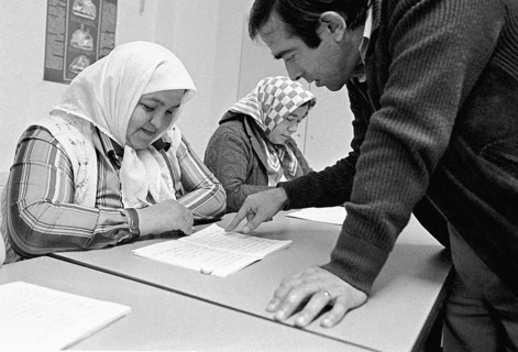 Turkish woman learn the alphabet in a language course, Gelsenkirchen, Germany