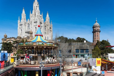 Parc d'atraccions Tibidabo amusement park and Expiatori del Sagrat Cor church in Barcelona, Spain