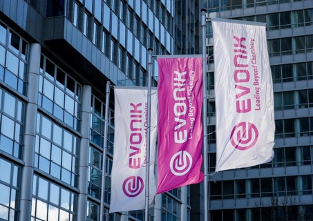 Essen, North Rhine-Westphalia, Germany - Evonik, flags fluttering on the flagpole in front of the