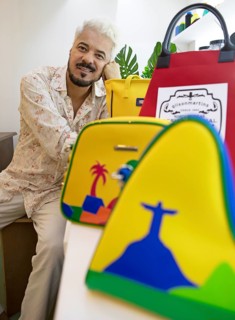 Bag designer Gilson Martins with some of his bags, Rio de Janeiro, state of Rio de Janeiro, Brazil