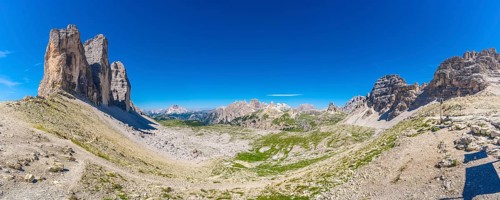 Panoramic view of the tre cime di lavaredo hiking trail in summer, featuring the iconic peaks,