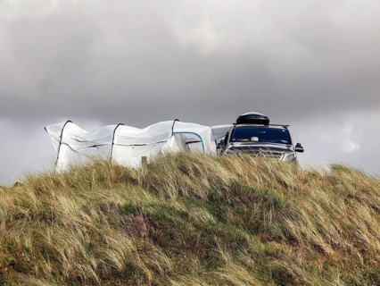 A Mercedes V-Class motorhome standing in the dunes of a campsite, Vejers, Denmark, 16 07 2023
