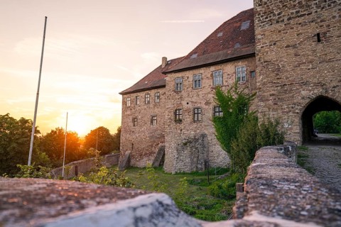 Historic castle with stone walls in the light of the sunset, Allstedt, Harz, Germany