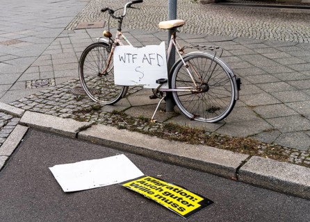 Bicycle with election slogan on a lamppost, Berlin, Germany