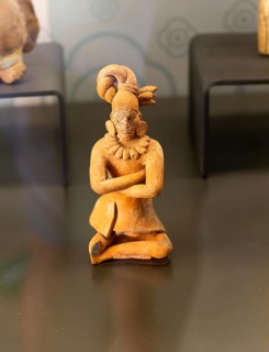 Figurine model of sitting man with facial scarring, from Jaina, Late Classical period, Mayan