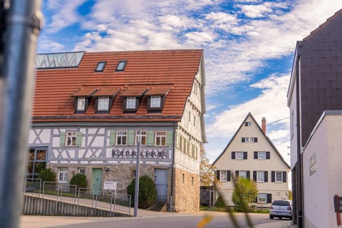 Traditional half-timbered house in the village, cultural centre on a sunny day, Jettingen, Black